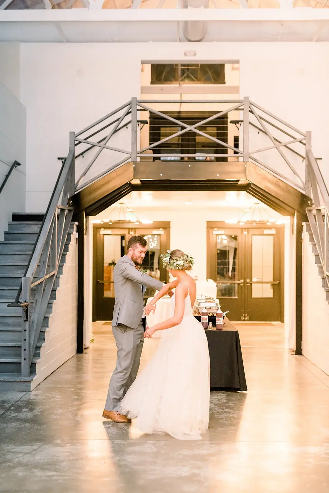 The grand entrance: twin staircases and chandeliers