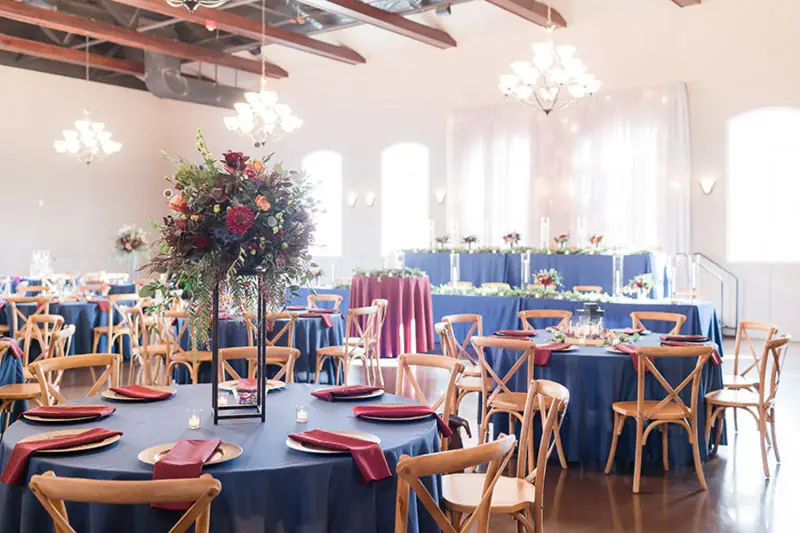 The Cascata hall set for dinner with tall florals
