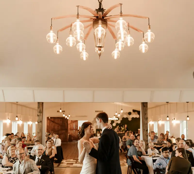 A first dance under the hall’s chandeliers