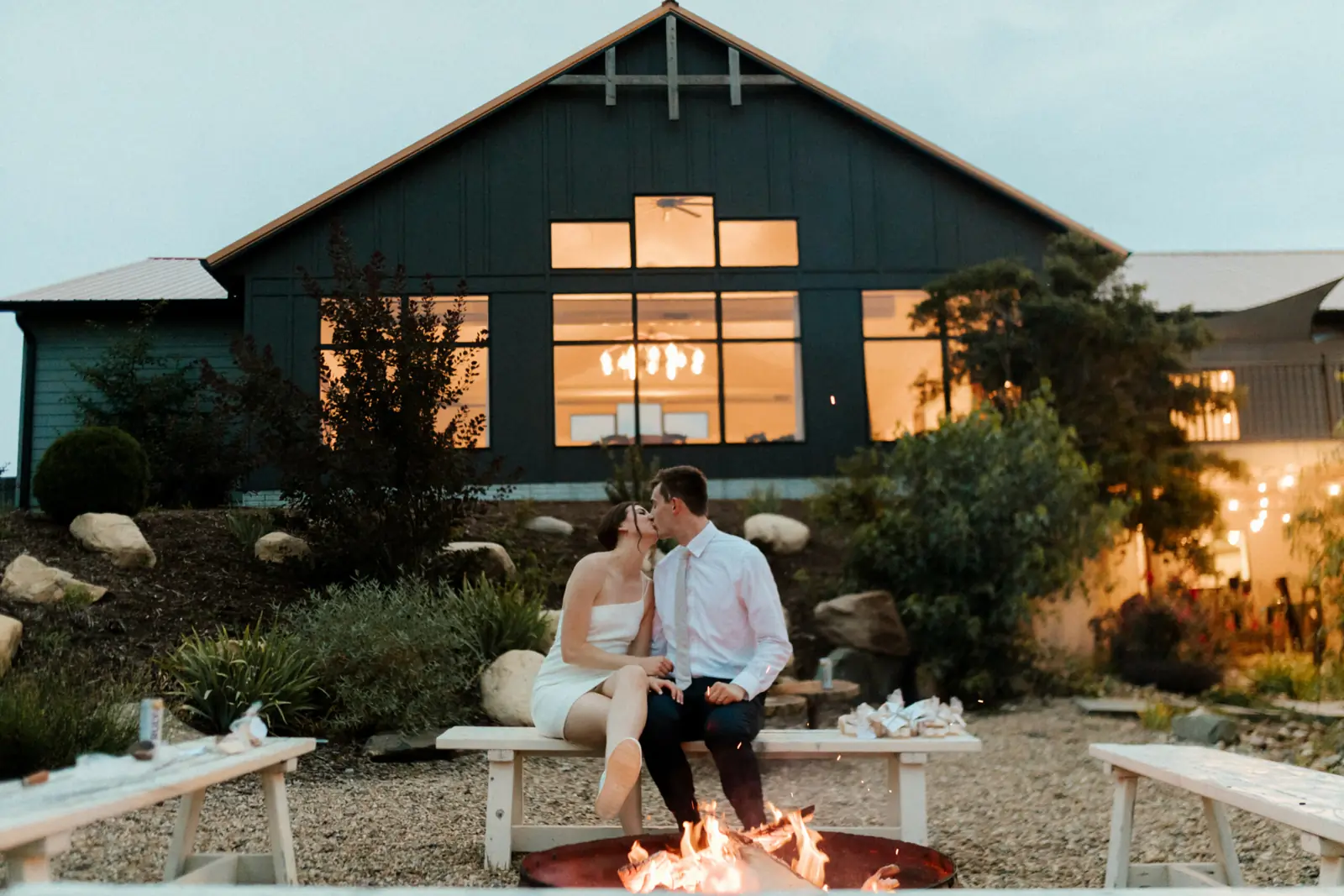 The venue at dusk, fire pit lit