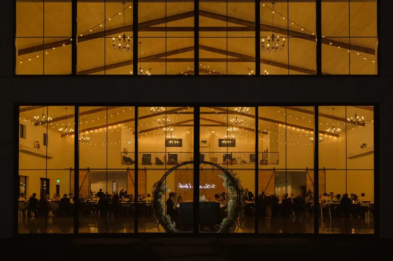The glass-walled main hall glowing after dark