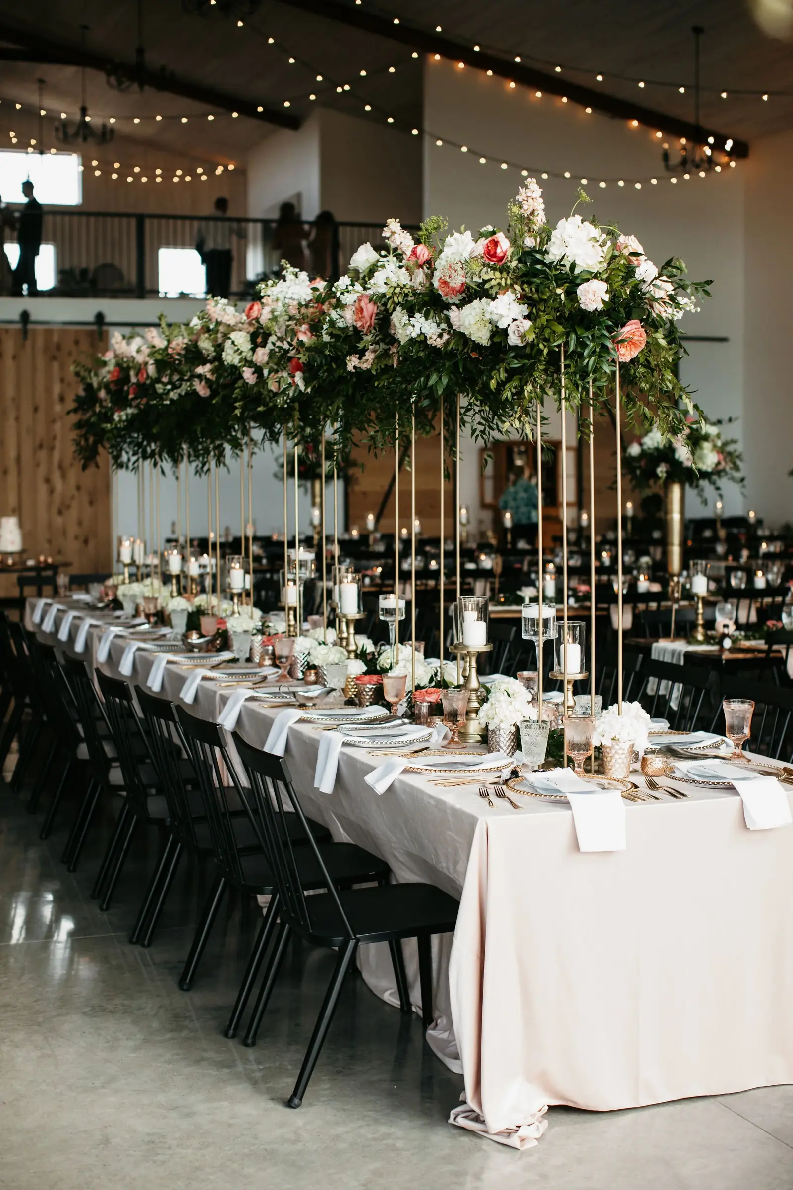 Long tables under suspended florals