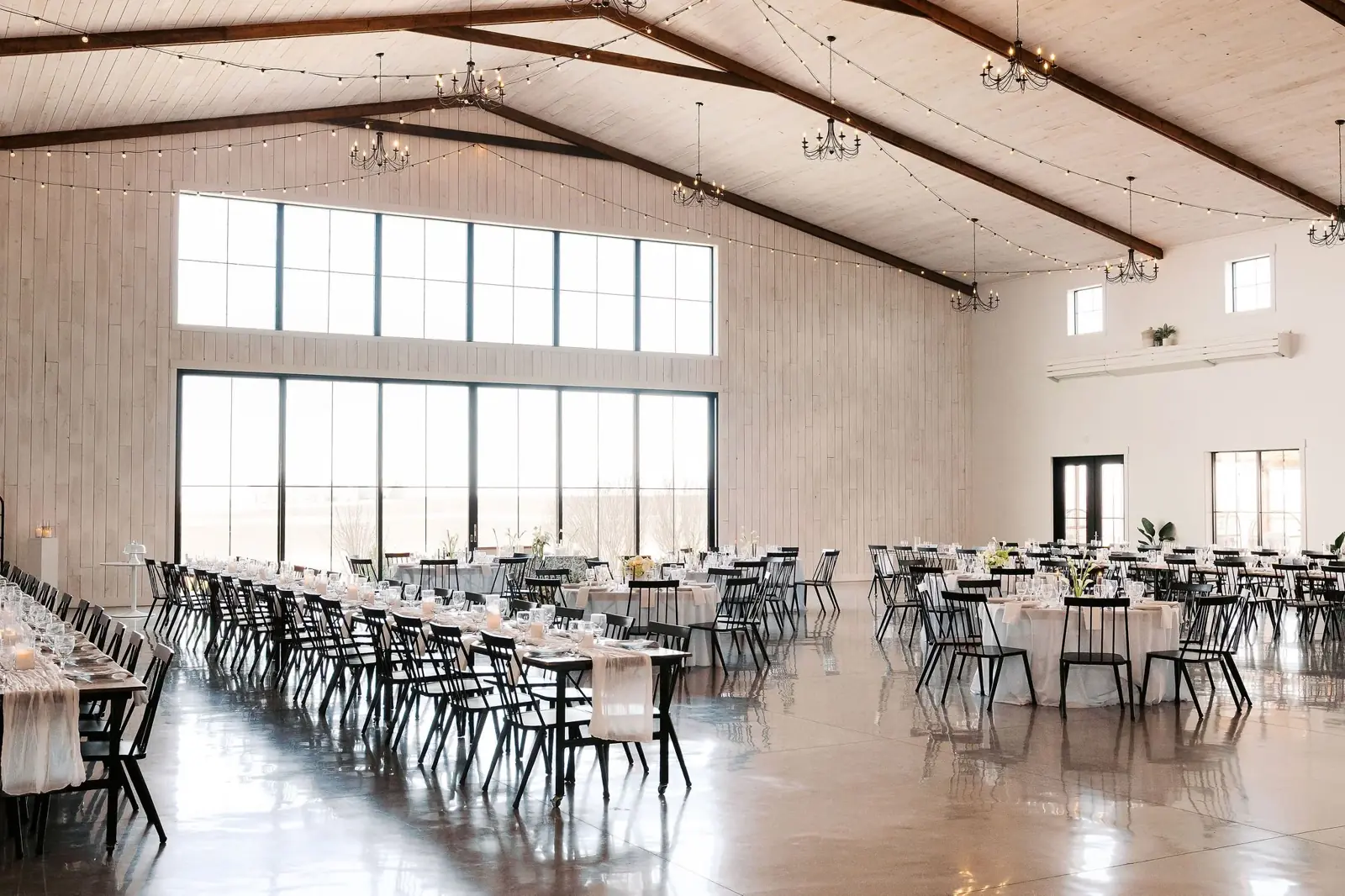 The main hall set for dinner, walls of windows