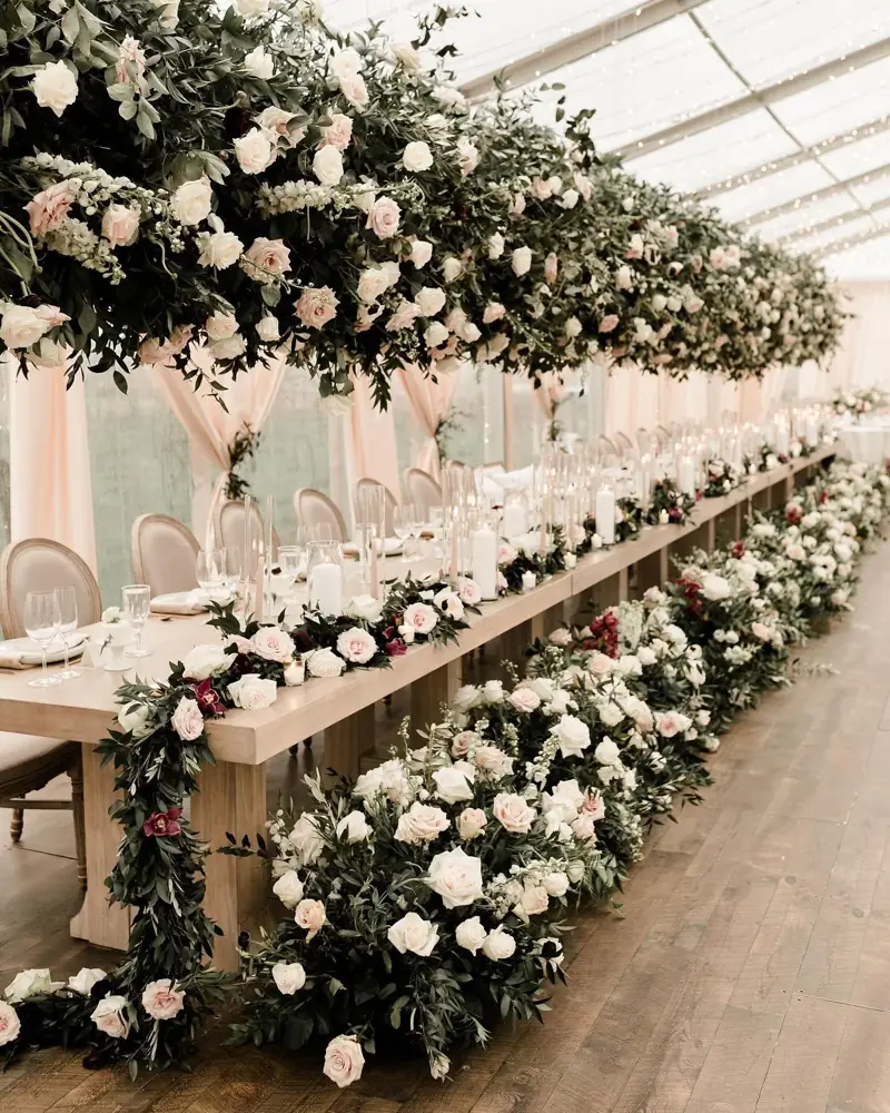 Long harvest tables dressed in flowers
